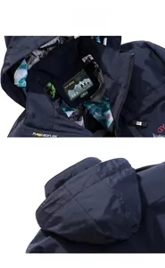 Detail view of the navy blue hooded jacket featuring camo mesh lining and outdoor labels