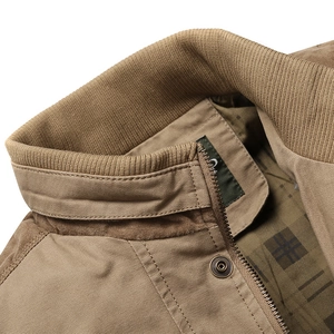 Men's khaki stand collar jacket with metal zipper and grid patterned lining detail