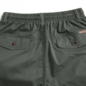 Men's dark green casual elastic waist pants with flap back pockets and leather detail