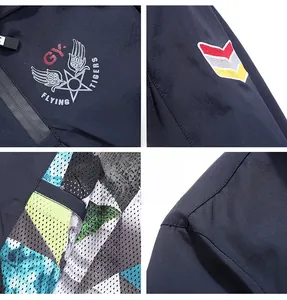 Detail of Flying Tigers embroidery and breathable mesh lining on navy blue jacket