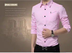 Detail of pink slim-fit long-sleeve cotton shirt with black buttons and chest pocket