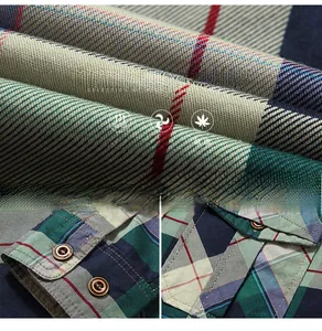 Detailed view of plaid cotton shirt fabric texture and brown cuff button closure