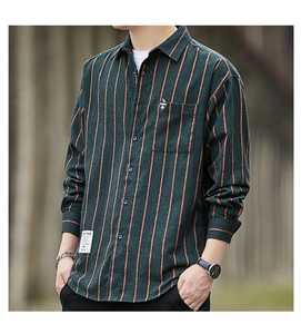 Detailed view of dark green striped flannel shirt with chest pocket and fashion labels