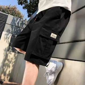 Men's black cargo shorts in a loose fit with large side pockets and woven labels