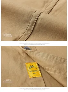 Close-up of double stitching detail and outdoor fashion label on khaki cotton shirt