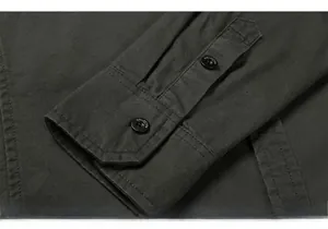 Detailed macro view of dark army green twill fabric cuffs with durable double stitching