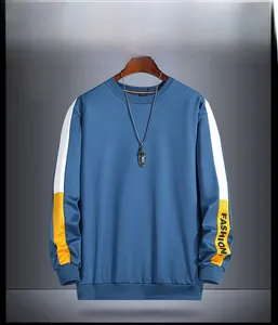 Detail view of denim blue sweatshirt with contrast sleeves and fashion letter print