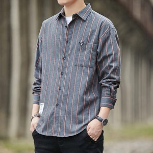Men's casual long-sleeved shirt with vertical orange stripes and grey base in outdoor setting