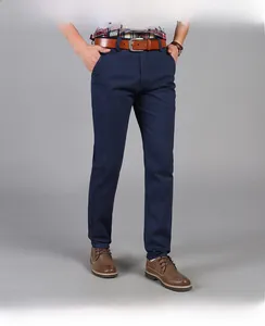 Close-up of men's dark blue straight-leg business trousers with premium fabric texture