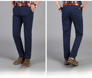 Detail view of navy blue straight-leg chinos with side pockets and buttoned back pockets