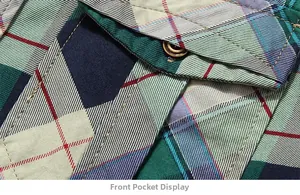Detail shot of green and blue plaid cotton shirt showing pocket and wooden button