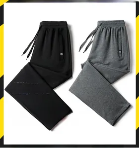 Detailed view of elastic casual pants in black and grey with drawstring waist design