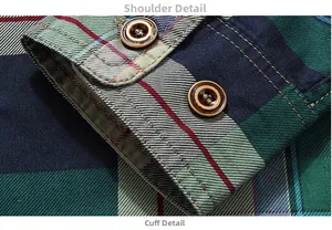 Close-up of cotton plaid shirt fabric with green and blue patterns and brown buttons
