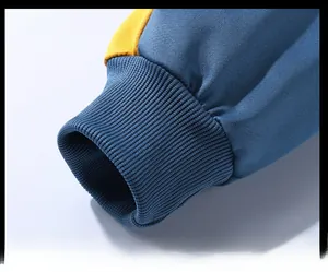 Detail shot of the elastic ribbed cuffs with blue and yellow contrast stitching