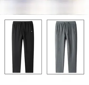 Detail view of men's casual cotton joggers featuring elastic drawstring waist in black and grey