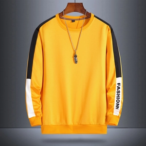 Men's yellow crewneck sweatshirt with black and white sleeve patchwork and fashion print