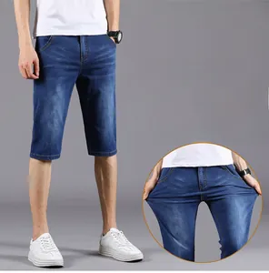 Close-up of flexible denim shorts with stretch fabric and natural whiskering effects
