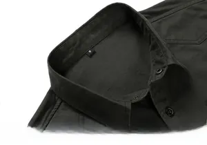 Detail of dark green cotton shirt collar with M size tag and premium black buttons