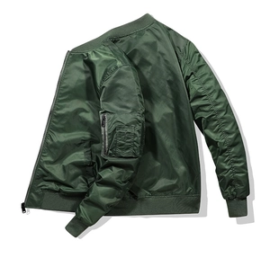 Detailed view of military green MA-1 flight jacket with classic utility sleeve pocket