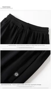 Detail of men's black joggers showing elastic drawstring waist and side pocket with flower badge