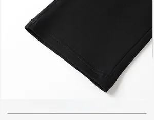 Detail shot of black cotton casual pants featuring reinforced double-stitched hems