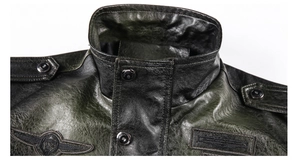 Detail of vintage faux leather jacket collar with shoulder straps and embroidered eagle patch