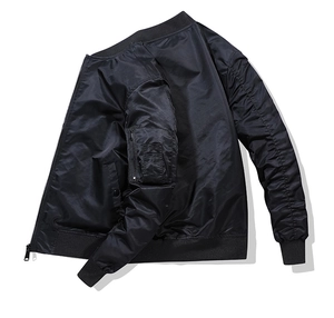 Detail of MA-1 flight jacket showing the utility sleeve pocket and ribbed collar texture