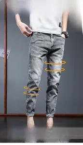 Detailed close-up showing 3D cut and elastic texture of slim fit gray denim jeans