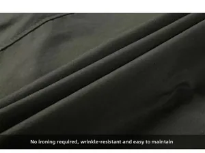 Macro shot of olive green non-iron fabric showing anti-wrinkle and smooth texture