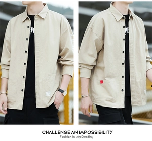 Detail view of khaki cotton work shirt featuring double pockets and sleeve letter prints