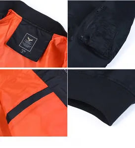 Detail view of MA-1 bomber jacket featuring zip arm pocket and orange lining