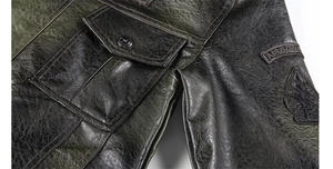 Detailed close-up of a military-style faux leather jacket with airborne sleeve patches