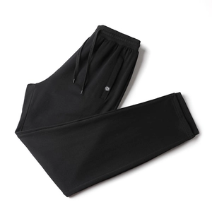 Men's black casual cotton knit joggers with drawstring waist and logo detail