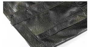 Close-up of vintage washed PU leather jacket with detailed stitching and metal buttons