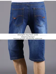 Detail showing straight leg opening and hemmed design on blue denim shorts