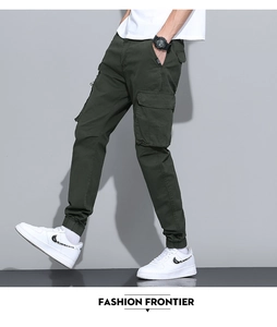 Detail view of cargo pants featuring side flap pockets and reinforced stitching