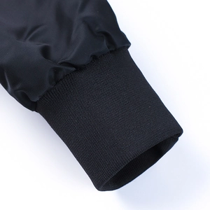 Classic black MA-1 bomber jacket with windproof fabric and ribbed elastic cuffs
