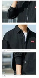 Detail view of cotton shirt stitching, shoulder seams, and logo on black workwear top