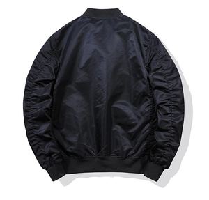 Back view of black bomber jacket showing ribbed cuffs and pleated sleeve details