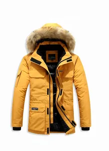 Detail view of yellow hooded parka with detachable faux fur collar and windproof cuffs