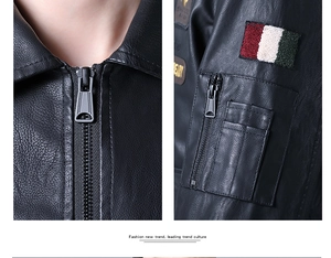 Close-up of black PU leather motorcycle jacket with embroidery and zipper pocket
