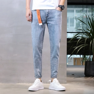 Slim fit light blue wash stretch denim jeans for men with stylish rolled cuffs and casual belt