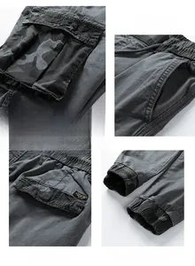 Detail of dark grey cargo pants with camouflage pocket accents and drawstring waist design