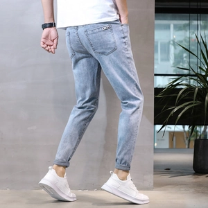 Slim fit light blue men's stretch denim jeans with stylish back pocket woven label