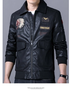 Detailed close-up of intricate Indian chief embroidery on black leather biker jacket
