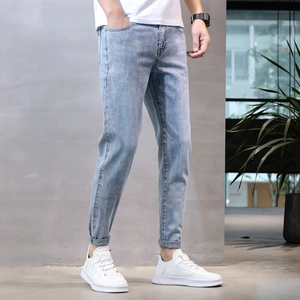 Slim fit light blue men's stretch jeans with stylish cuffed hems for spring and summer