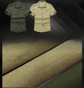 Close-up of military style short sleeve shirts showing twill cotton fabric and epaulettes