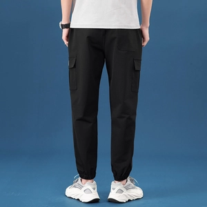 Men's black cargo joggers with functional side flap pockets and elastic cuffs