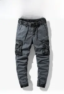 Detail of dark grey cargo joggers with camouflage pocket accents and drawstring waist