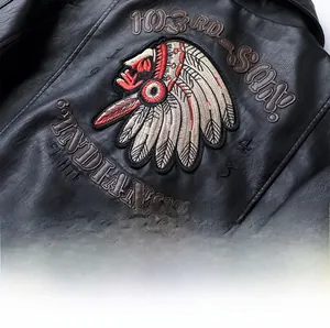 Detailed embroidery on back of black faux leather motorcycle jacket featuring Indian head motif
